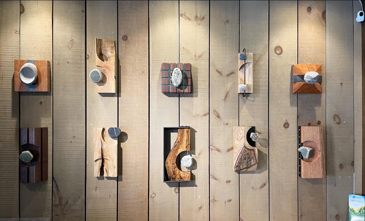 Gallery wall of wood and stone sculptures at Sage Bird Ciderworks